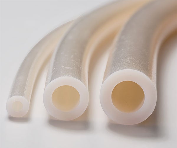 Perfluorolastomer/ePTFE composite tubing for aggressive chemicals