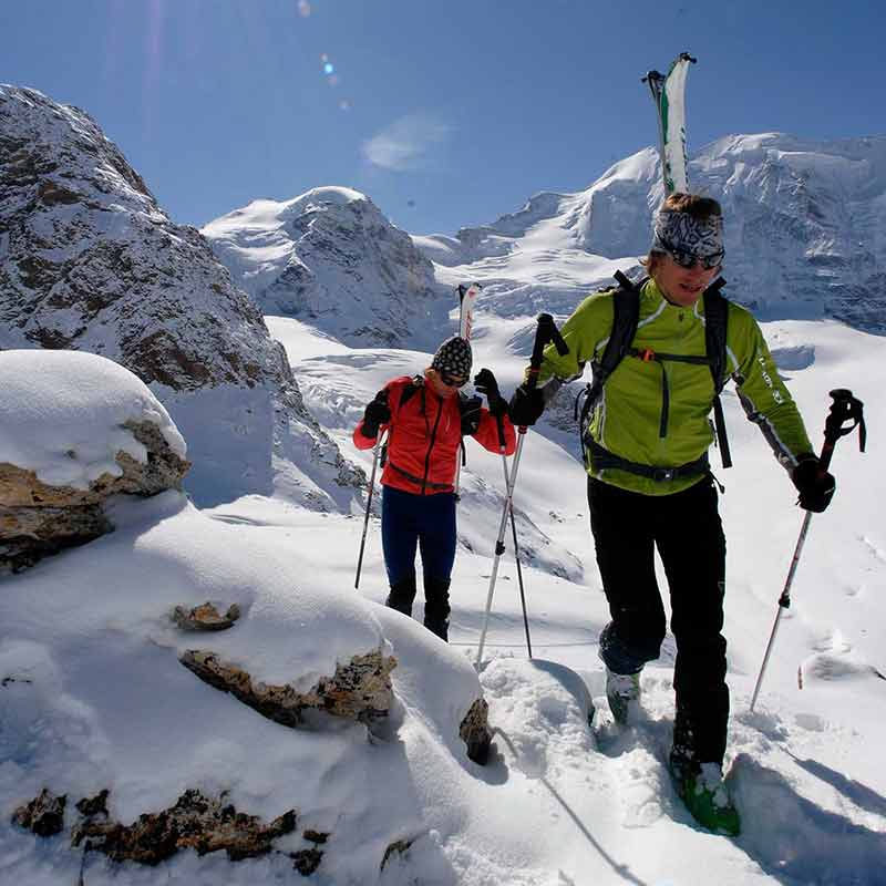 Hikers in the snow covered mountains